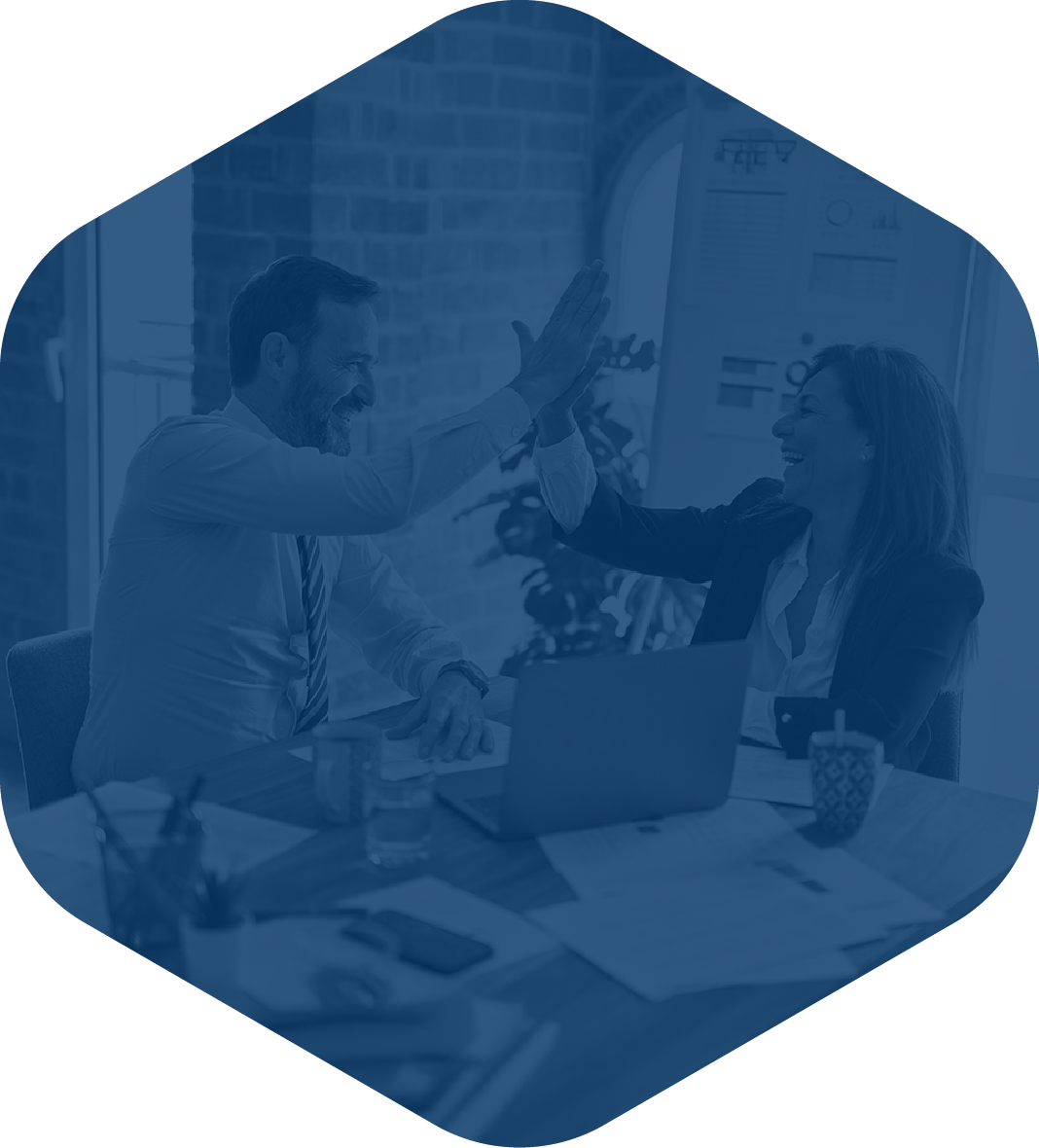 Two people grooming a dog